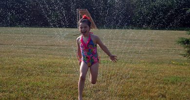 The city has re-opened parks to limited use. Willow Bassett, 6, stays cool in Corkery. Photo by Jake Davies