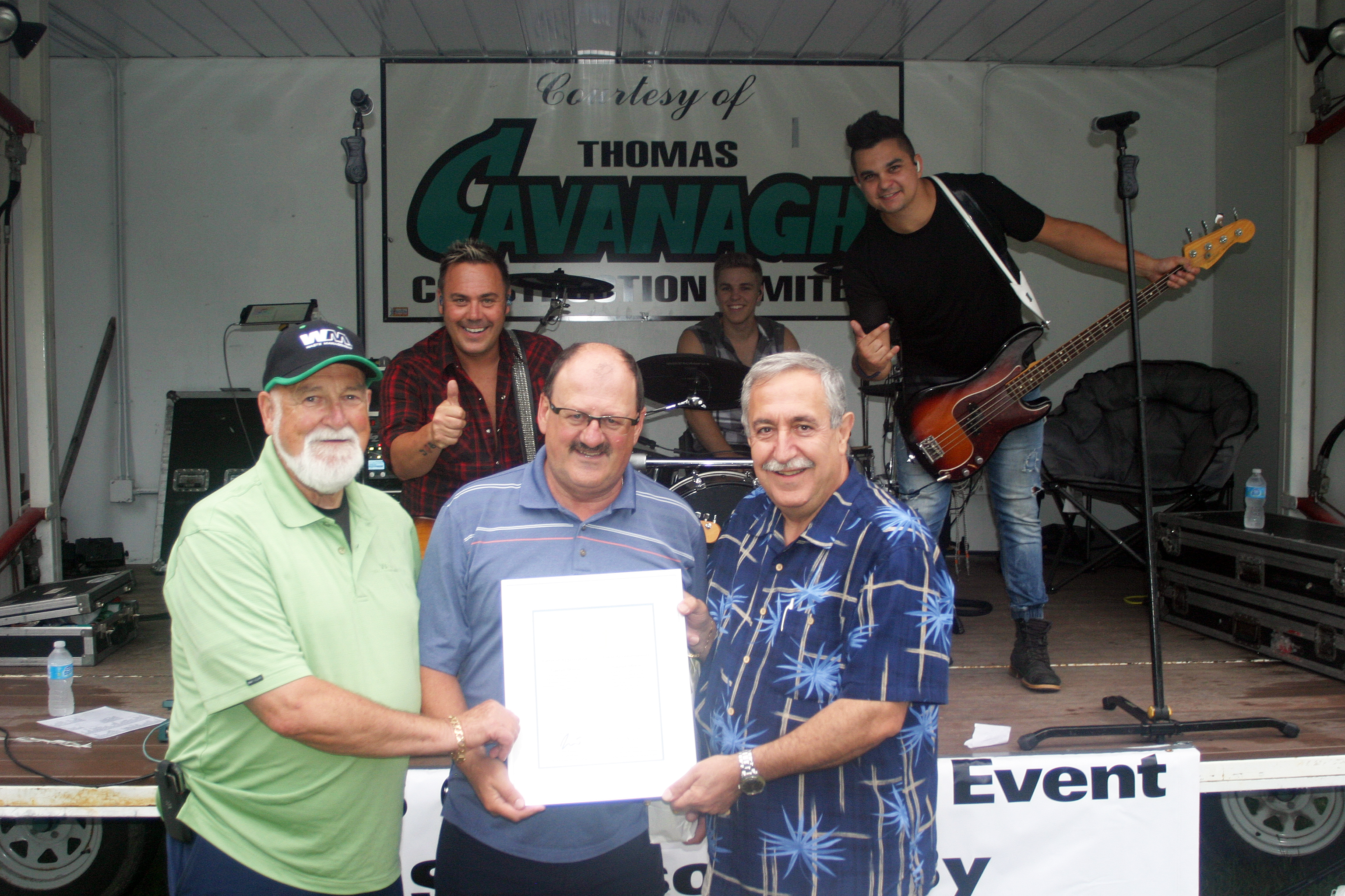 Gaeten Morin, centre, was honoured for his commitment to the Concerts in the Park series on Thursday evening. Photo by Jake Davies