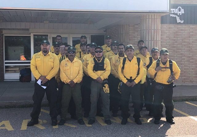 Mexican firefighters pose for a photo at the Pembroke airport before going to work. Photo courtesy Pembroke and Area Airport