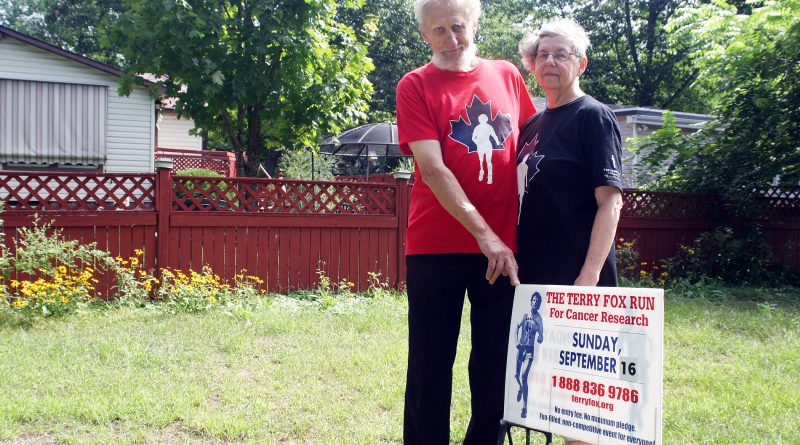 Bob Dupuis and Linda Cassidy pose for a photo in 2018 at their property promoting the Terry Fox run at the time. Photo by Jake Davies
