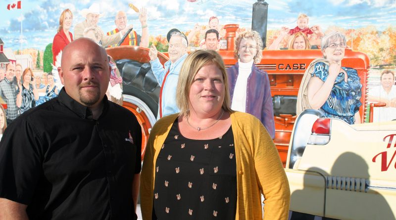 Carp Fair President of Agriculture Chad Findlay and President of Homecraft Lisa Belton pose in front of the 150th Anniversary Mural - see if you can spot them in the mural too. Photo by Jake Davies