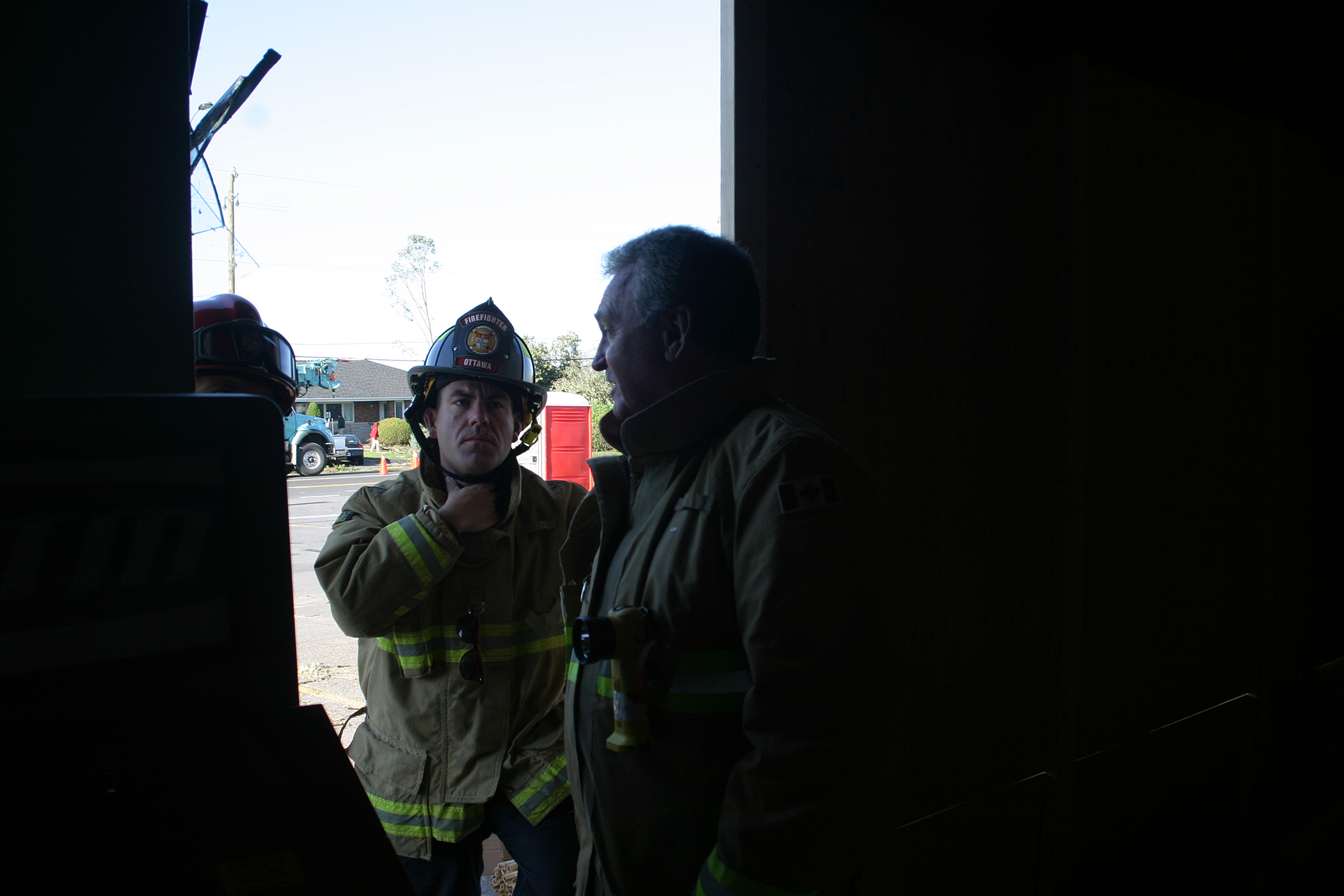 Ottawa Fire Services Sector Chief, Operations Chris Burke exits Dunrobin Meat and Grocery. Photo by Jake Davies