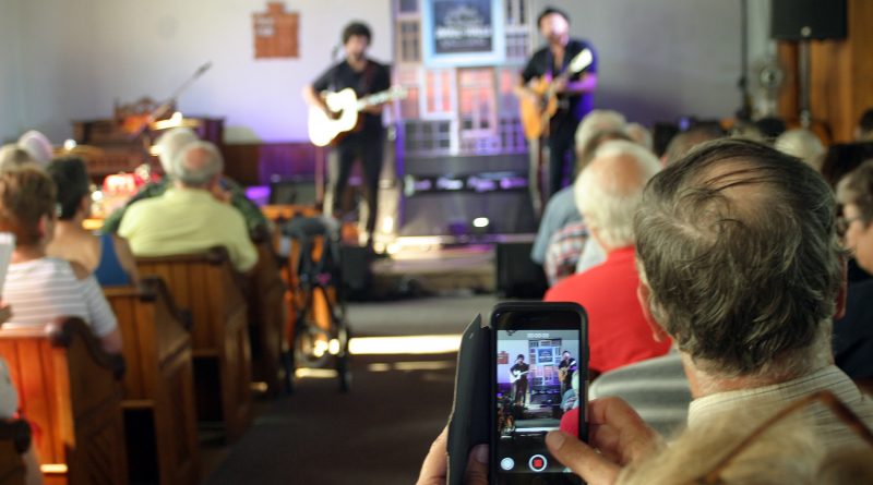 MP Karen McCrimmon does a little recording of the Small Halls concert held at St. Andrew's Presbyterian Church in Kilmaurs on Sunday. Photo by Jake Davies