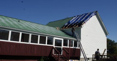 Contractors were busy working on the Galetta Community Centre roof on Oct. 4. The roof was torn off by a suspected microburst on Sept. 21. Photo by Jake Davies
