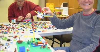 Masterbuilders at work at the Carp library's adult-only Lego party. Photo by Lori Fielding