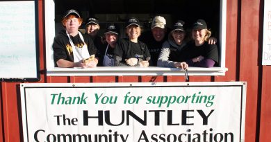 Volunteers pose for a photo at the burger hut.