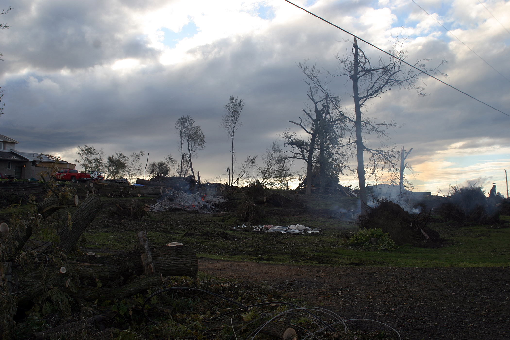 A Woodkilton Road resident is hard at work burning the debris that was formally a treed lot on Saturday, Nov. 29. Photo by Jake Davies