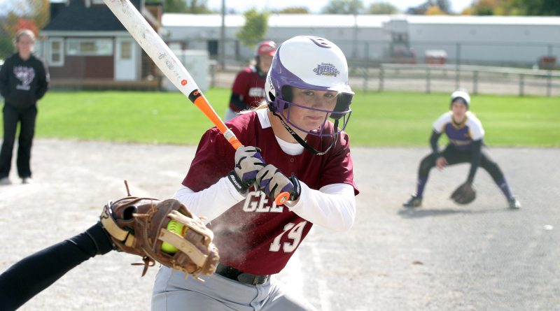 uOttawa Gee Gee player Megan DuPuis looks at a strike while Jen MacKay looks to get home from third. Photo by Jake Davies