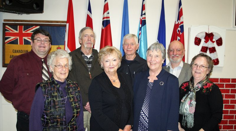 The new FTHS board poses for a photo after dinner. In the back row, from left, are Warren Lesway, Jim Armstrong, Pat Armstrong and Terry Currie. In front are Betty Dowd, Elaine Patterson, Iva Duncan and Pat Tait. Photo by Jake Davies