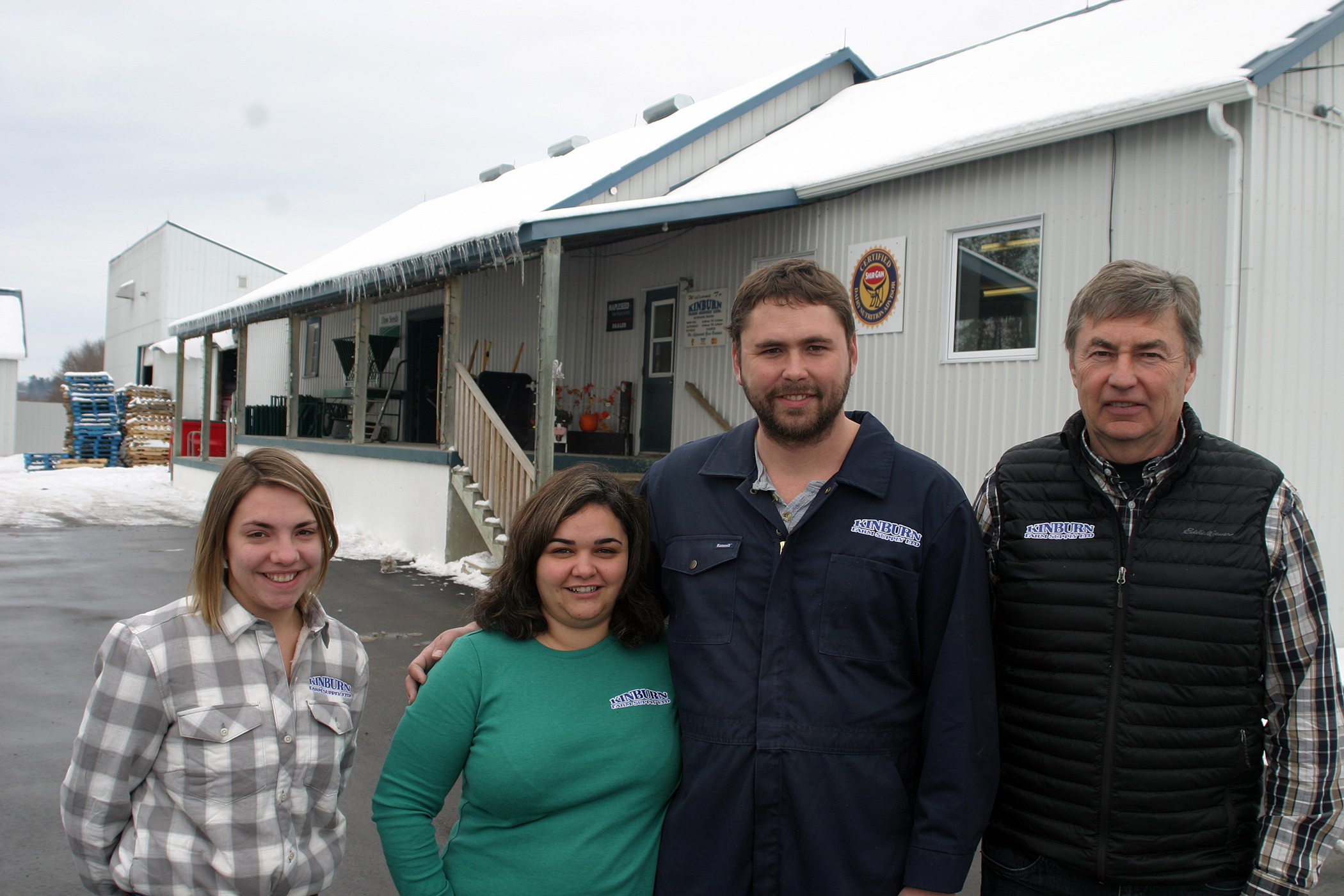 From left, Lisa Shyer, Melissa Herrick, Michael Herrick and John Herrick pose outside Kinburn Farm Supplies. Photo by Jake Davies