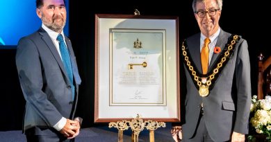 Paul Dewar, left, receives the Key to the City from Mayor Jim Watson. Photo submitted