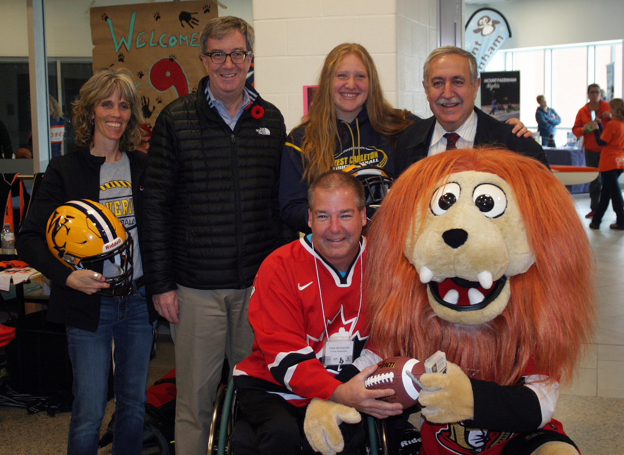 From left, West Carleton Wolverine's Natalie McArdle, Mayor Jim Watson, Wolverine B Cup winner Brooke Bean, Coun. Eli El-Chantiry and up front Todd Nicholson and Sparty were all at the The Rebuilding Our Communities Through Sport event last Saturday. Photo by Jake Davies