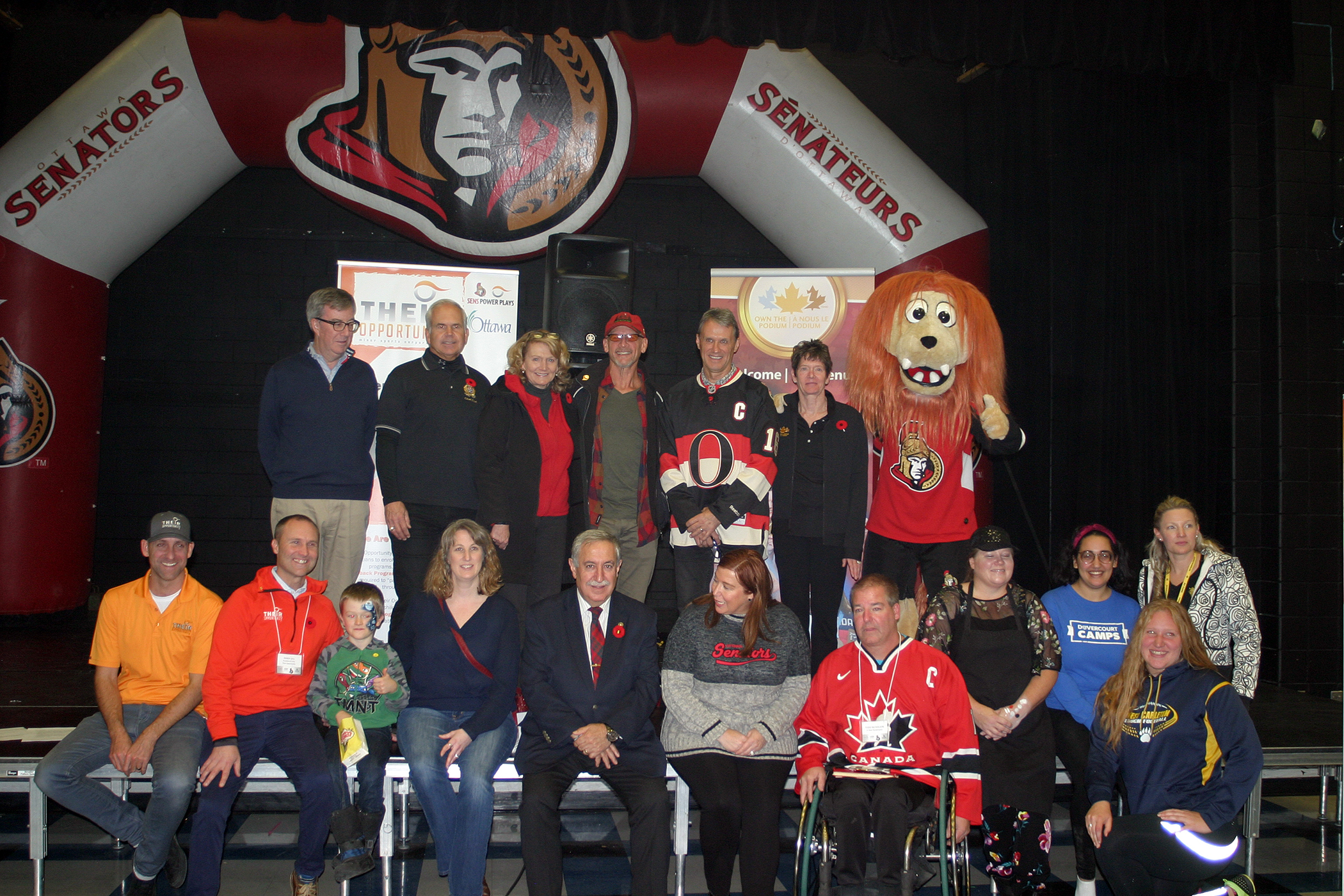 Organizers, program participants and sponsors pose for a photo following the announcement. Photo by Jake Davies