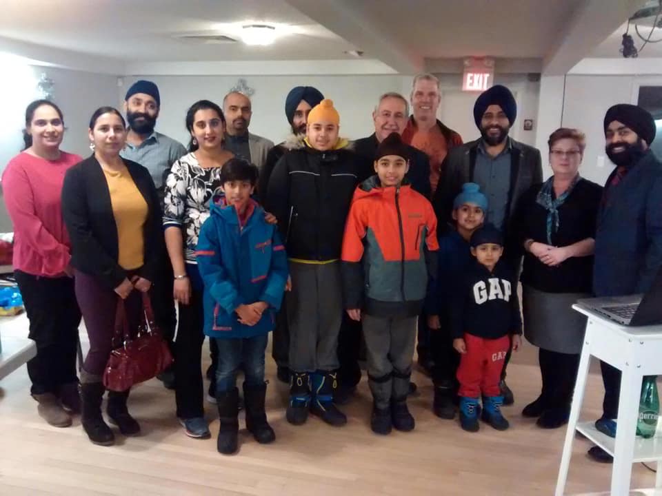 Supinderjit Singh and his team from UFoundation presented gift certificates to families displaced by the Sept. 21 tornado. Courtesy Supinderjit Singh