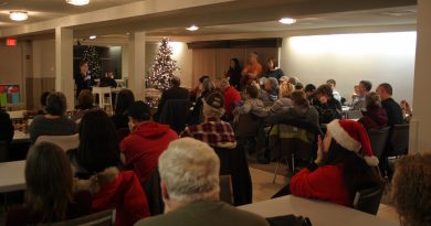 WCDR vice president Angela Bernhardy addresses about 75 people at the last tornado recovery meeting of 2018 last night (Dec. 20). Photo by Jake Davies