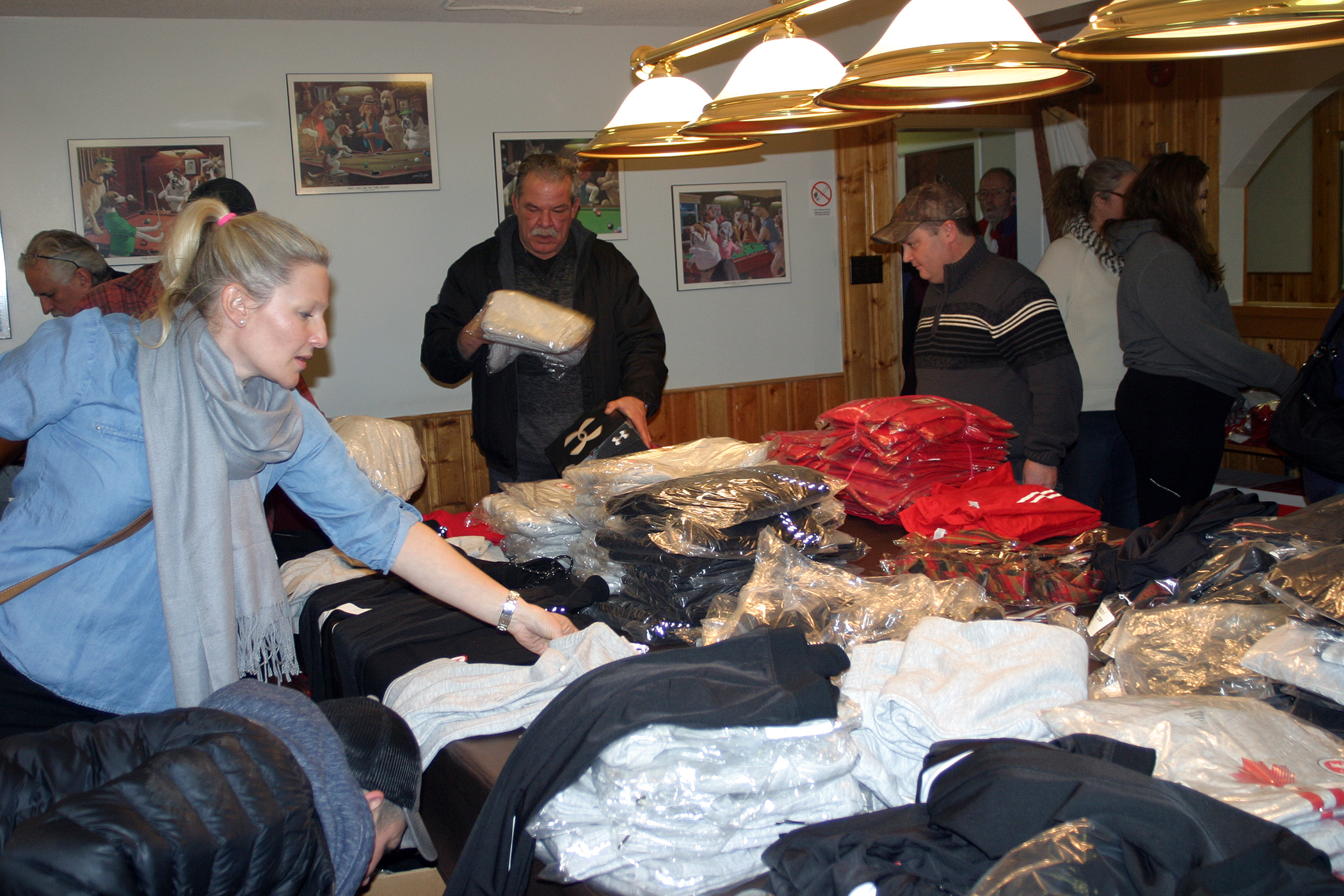 Dunrobin resident Emily Glossop-Nicholson sorts the huge donation of clothing and footwear her and her husband were able to secure. Photo by Jake Davies