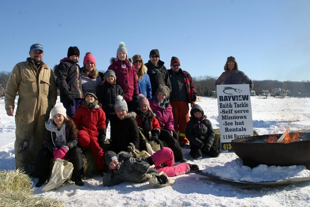 Kids and organizers pose for a photo in the early hours of the 12th annual Constance Bay Kids Ice Fishing Derby. Photo by Jake Davies