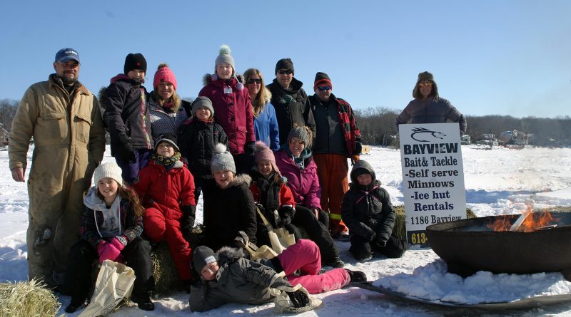 Kids and organizers pose for a photo in the early hours of the 12th annual Constance Bay Kids Ice Fishing Derby. Photo by Jake Davies