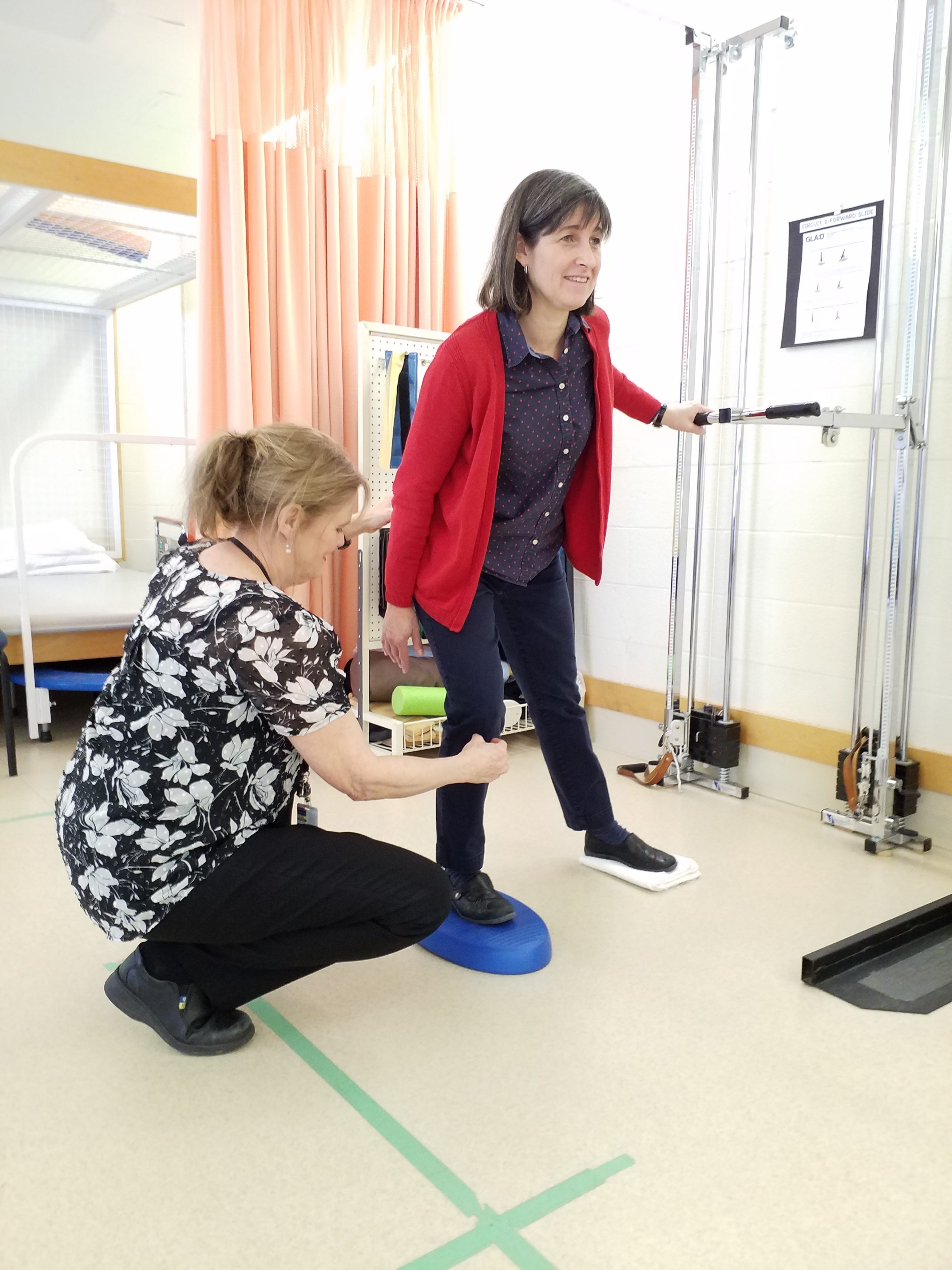 Physiotherapist Janet McGonigal (left) demonstrates a GLA:D OA neuromuscular training exercise with fellow Physiotherapist Kim Dyer. Courtesy AGH