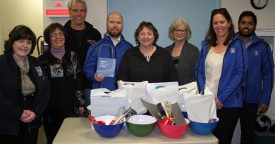 The Dunrobin Community Association and staff of the Royal Bank of Canada pose with the RBC's donation of kitchen supplies for the special needs cooking program. Photo by Jake Davies