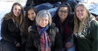 From left, WCSS students Michelle Gandelman, Sylvia Qi, Savvy Seconds' Vera Jones, Sam Sharp and Alicia Briggs pose with a truckload of donated clothes. Photo by Jake Davies