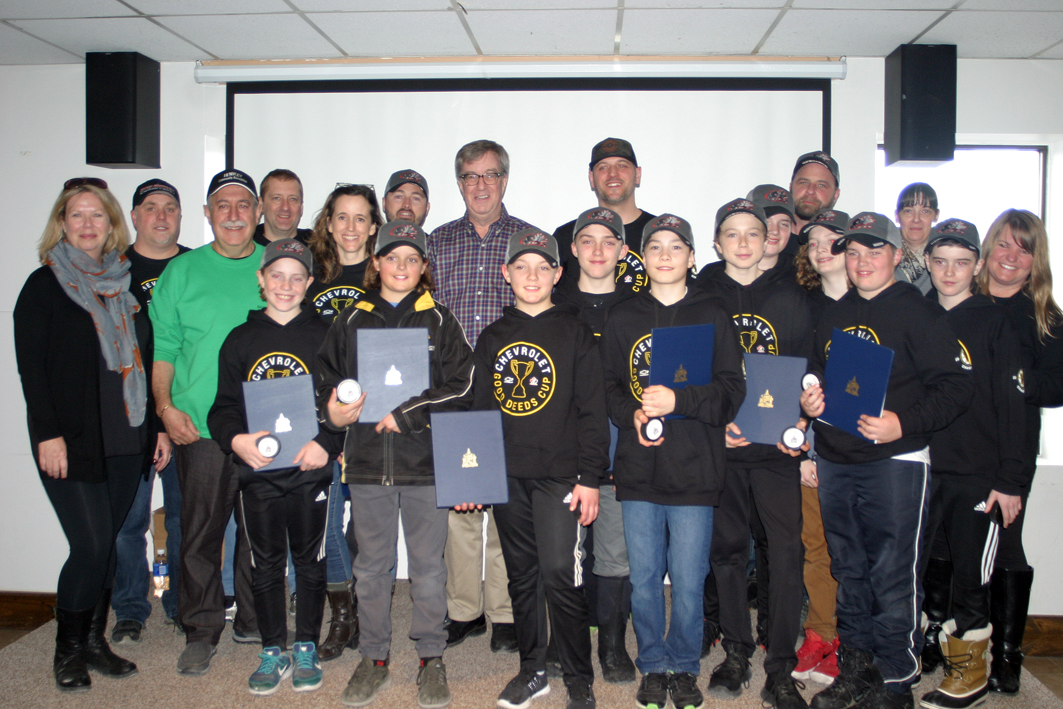 Warriors players, coaches and parents pose with the mayor and Coun. El-Chantiry. Photo by Jake Davies