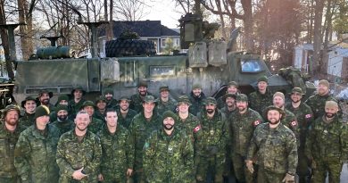 Members of 13 TP D Squadron of the Royal Canadian Dragoons pose for a photo after a day of work in Willola Beach. Photo by Britta Gerwin