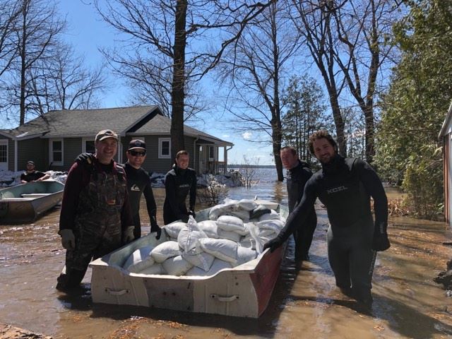  
Members of River Surf Ottawa-Gatineau provided some much needed water work in the frigid Ottawa River during Sunday's volunteer effort. Photo by Britta Gerwin