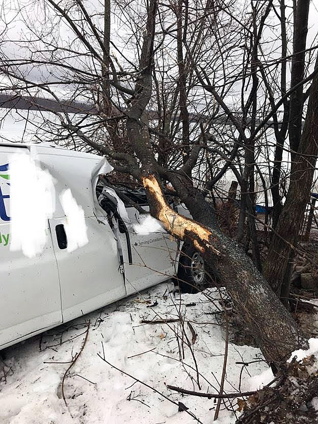 This van rolled several times before coming to rest against some trees near the Ottawa River this morning. Courtesy OFS