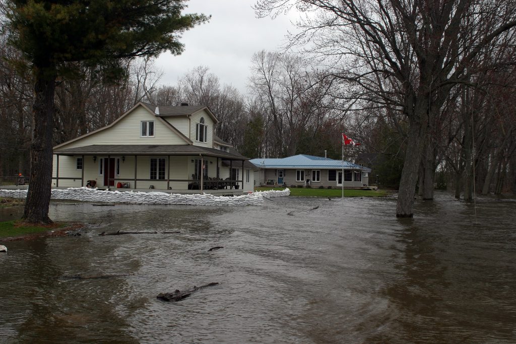 Former MPP Jack MacLaren's house in MacLaren's Landing has a small sandbag wall between it and the fast-rising Ottawa River. Photo by Jake Davies﻿