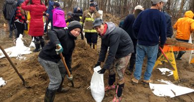 Students and staff from St, Michael's Fitzroy Harbour volunteered their time filling sandbags in the rain today (April 26). Courtesy Linda Ladouceur