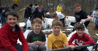 From left, Willola Beach residents Kayso Thompson, 9, Landon Dods, 9, Colton Dods, 11 and Keifer Thompson, 8, volunteered their Easter Sunday transporting sanbags to homes along the Ottawa River. Photo by Jake Davies