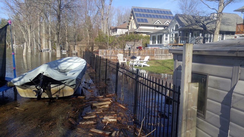 Just beside the Armitage sandbagging operation the Ottawa River is invading back yards and creeping closer to homes in the area. Photo by Jake Davies﻿