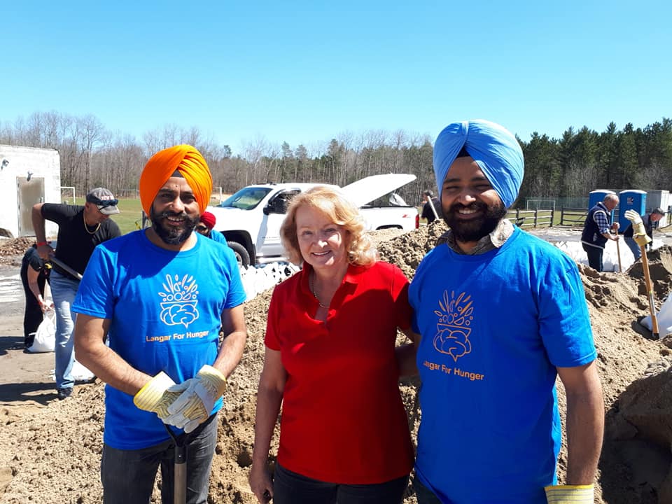 The Langar for Hunger team poses with MP Karen McCrimmon. Courtesy Langar for Hunger