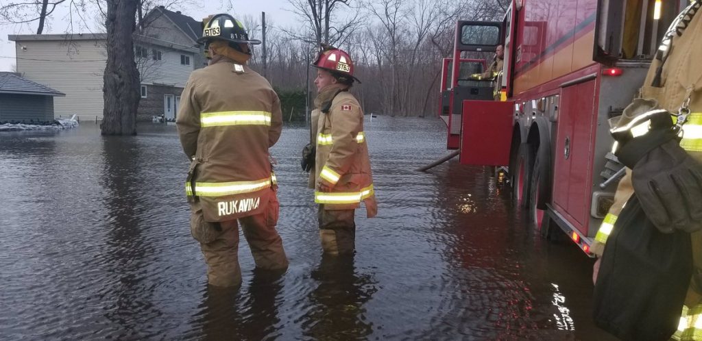 Constance Bay firefighters work in several feet of water battling the blaze that finished off Ryan Littler's home May 1, 2019. Courtesy OFS Chief Kim Ayotte