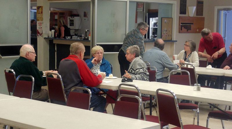 Some Constance Bay residents enjoy a community dinner at the West Carleton Royal Canadian Legion last Friday. It was the last meal the Legion will be providing to the flood-affected and volunteers after providing free food for more than a month. Photo by Jake Davies