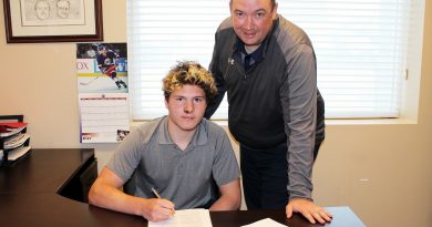Carp's Mason McTavish signs his committment to join the Peterborough Petes yesterday while general manager Mike Oke smiles broadly. Coutesy the Petes