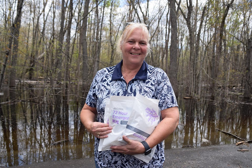 Deb Holtom receives her wellness kit while on the front lines of the flood battle. Photo by Shelley Welsh