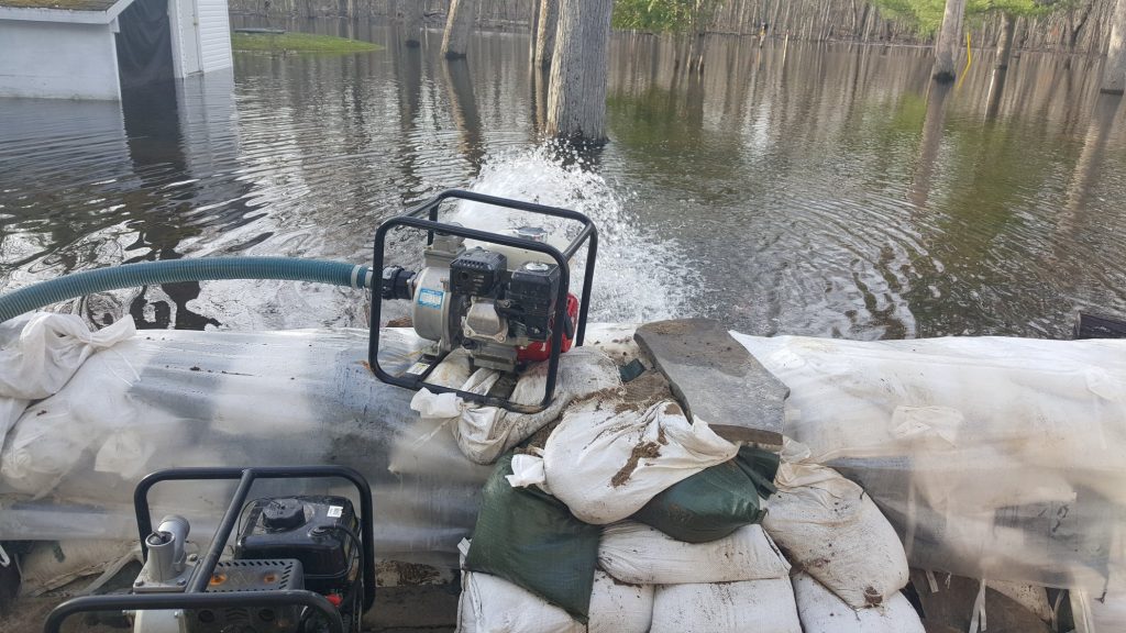 A sound wall and lots of pumping is keeping Stuart Hodge's home dry for now. Courtesy Stuart Hodge﻿