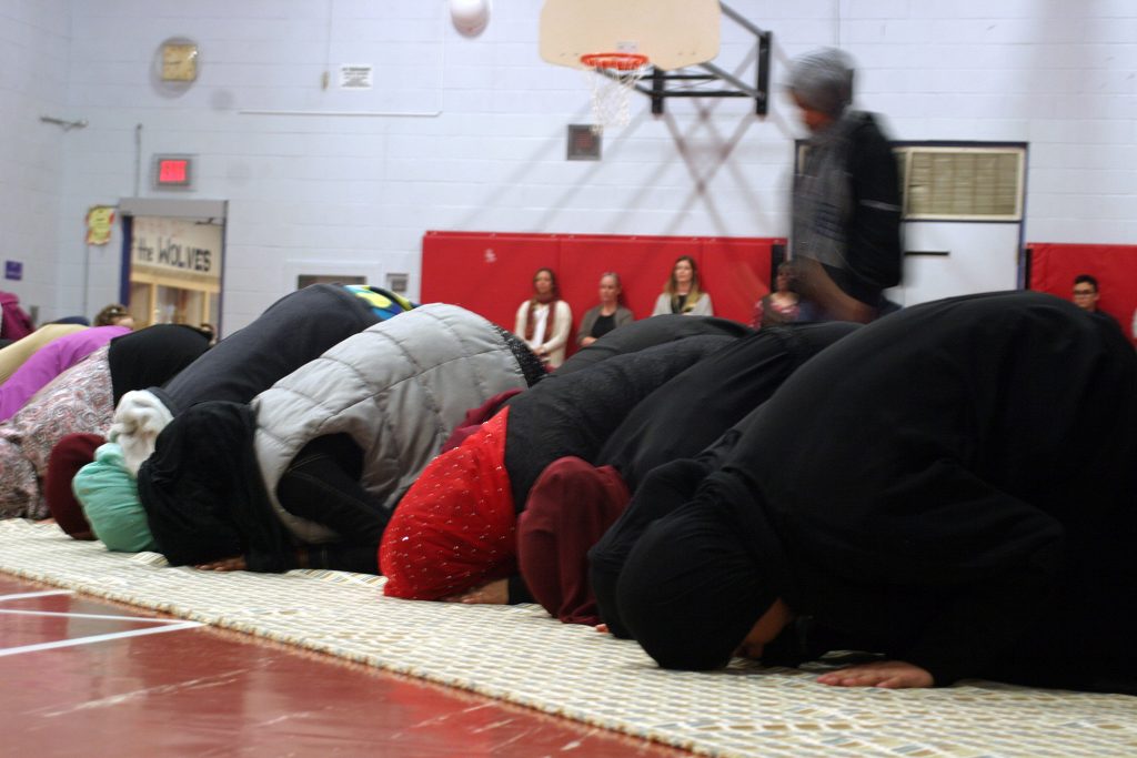 WCSS Muslim students and family members take part in evening prayers prior to Iftar. Non-Muslims were invited to watch the holy moment. Photo by Jake Davies