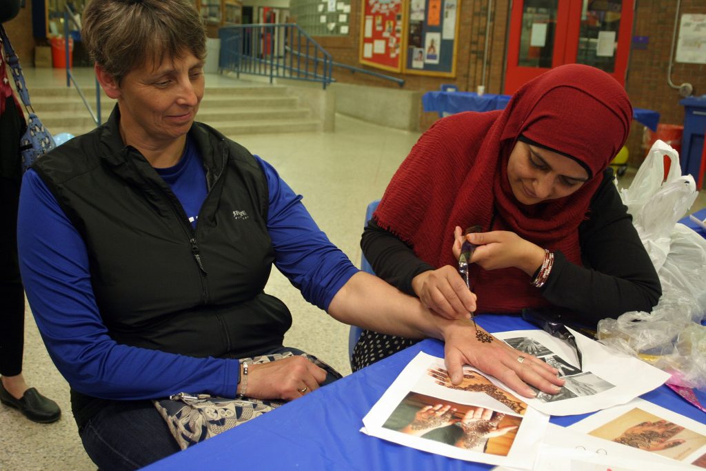 Shona Kemp gets a henna tatoo at the WCSS Iftar. All money raised from the tattoos went to support disaster relief. Photo by Jake Davies