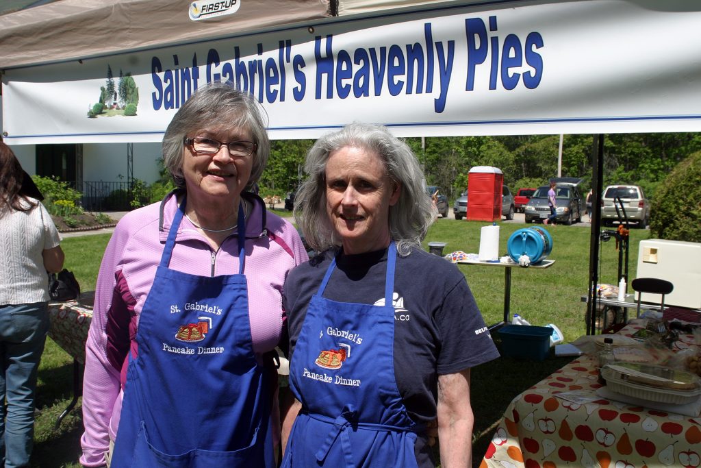 Volunteers, from left, Suzanne Lee and Jill Blyth had a great day selling heavenly pies. Photo by Jake Davies﻿