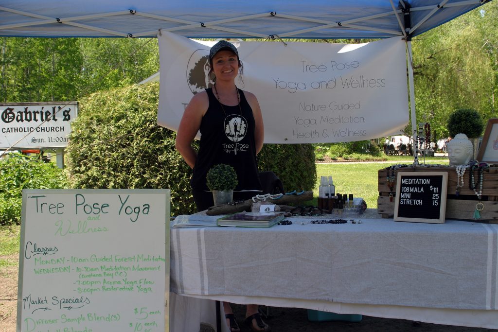 Victoria Lefebre of Tree Pose Yoga was offering meditation classes in the serene backdrop of the community market on the beautiful grounds of St. Gabriel's Catholic Church. Photo by Jake Davies