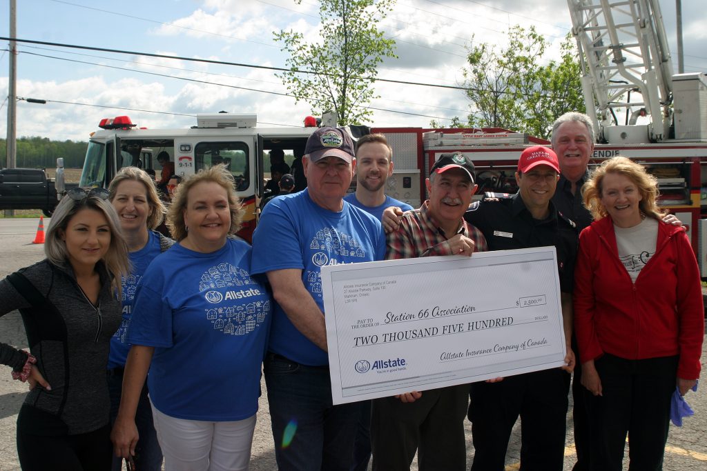 John Kealey and the Allstate Insurance team made a $2,500 donation to the Dunrobin firefighters' association, earmarked for disaster relief. Photo by Jake Davies