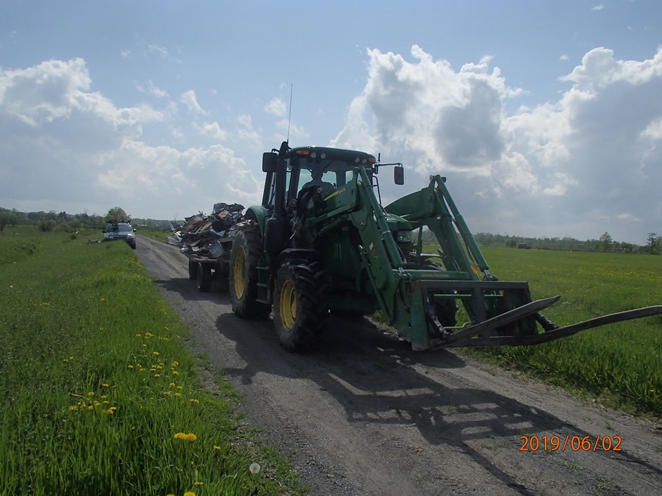 Leo Muldoon hauls away about a quarter of the debris volunteers picked up on Sunday. Courtesy Ruth Sirman﻿