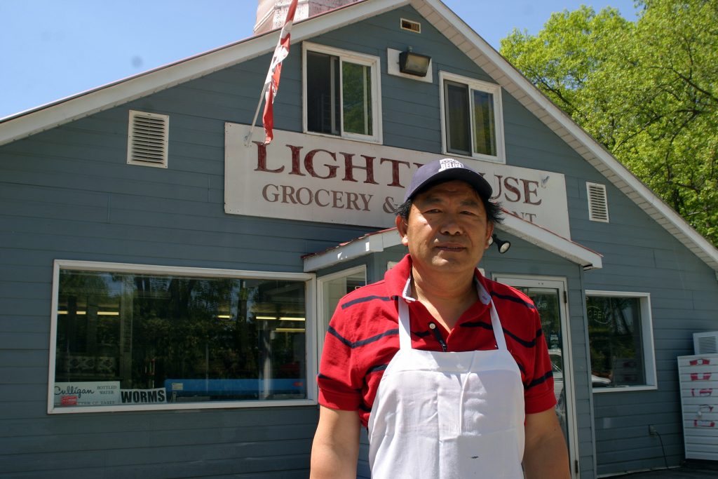 Lighthouse Restaurant owner Ji and his wife Sandy Zhang have dealt with two huge floods and now a pandemic in the last four years. Photo by Jake Davies