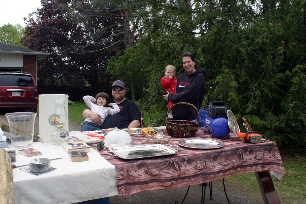 The Borthwick family was one of several that took part in Marathon Village's community garage sale last Saturday. From left are Lucille, 4, Ben, Damien, 11 months and Francoise. Photo by Jake Davies