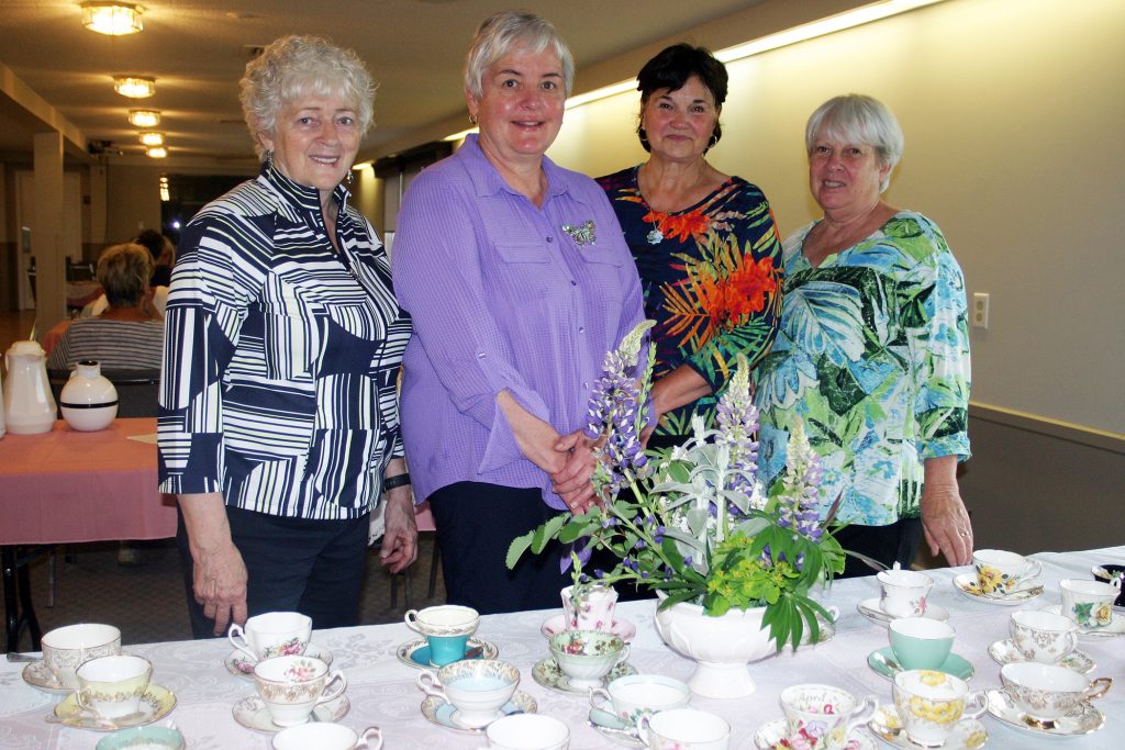 From left, Victorian tea volunteers Donna Caldwell, Brenda Baird, Susan Dowler and Nancy Argue pose for a photo. Photo by Jake Davies﻿