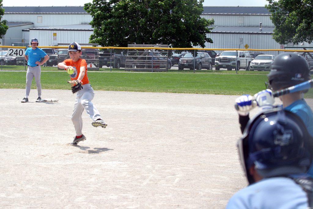 Kinburn's Will Herrick fires in a fastball against Fitzroy Harbour in the U14 championship game. Photo by Jake Davies