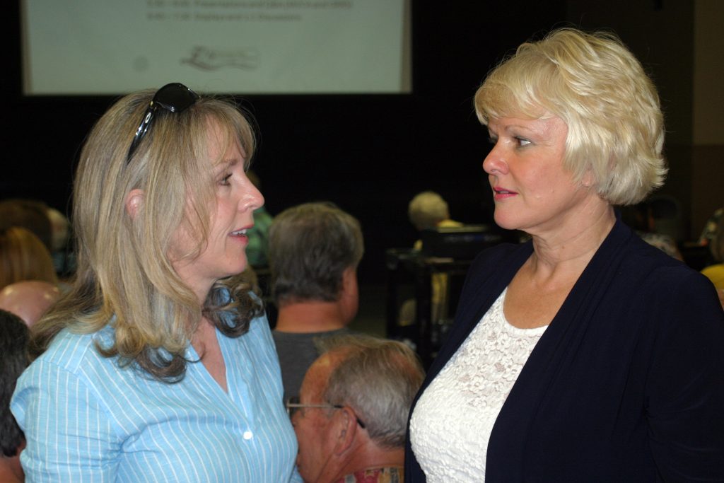 Kanata-Carleton MPP Dr. Merrilee Fullerton talks with Renfrew-Nipissing-Pembroke MP Cheryl Gallant before the presentations at last night's meeting. Photo by Jake Davies